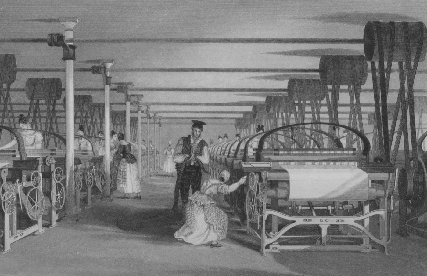 A 19th-century engraving of a large weaving room with rows of power looms tended mostly by women, driven by overhead shafts.